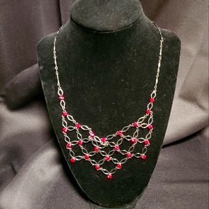 SEE DE P O P TO PURCHASE 90s bib necklace. Gunmetal gray with red vintage